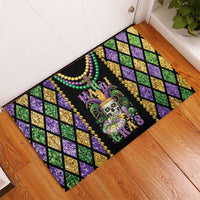 Rectangular rubber doormat with Mardi Gras skull, bead strands, and purple/green grid