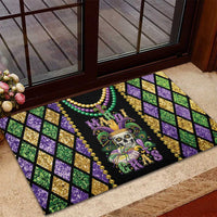 Rubber doormat featuring skull, fleur-de-lis, bead strands, and purple/green diamond print