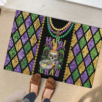 Rubber doormat with Mardi Gras skull design, beads, fleur-de-lis and purple/green diamonds