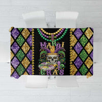 Black skull Mardi Gras tablecloth with purple, green, and gold diamond pattern and bead trim