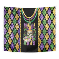 Close-up Mardi Gras skull tapestry with gold beads, purple green gold diamond pattern, and fleur-de-lis crown.