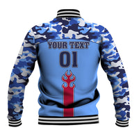Blue camo varsity jacket back with striped rib hem, YOUR TEXT 01, and flame emblem