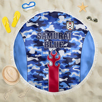 Round blue camouflage beach blanket with fringe, “Samurai Blue” graphic and crest.