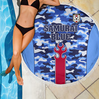 Blue camouflage round beach blanket with fringe edge, “Samurai Blue” and crest logo.