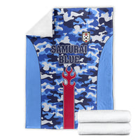 Blue camouflage football blanket with Samurai Blue lettering and red torch emblem, folded