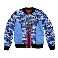 Blue camo bomber jacket with front zipper, ribbed cuffs, and Samurai Blue crest