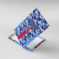 Framed blue camouflage canvas wall art, angled view, with Samurai Blue text and crest