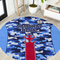 Round blue camouflage area rug with 'SAMURAI BLUE' text and crest patch