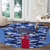Round blue camouflage area rug with central red vertical stripe and flame crest