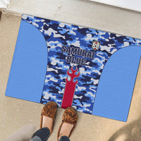 Blue rubber doormat with “Samurai Blue” text and red trident graphic on camo