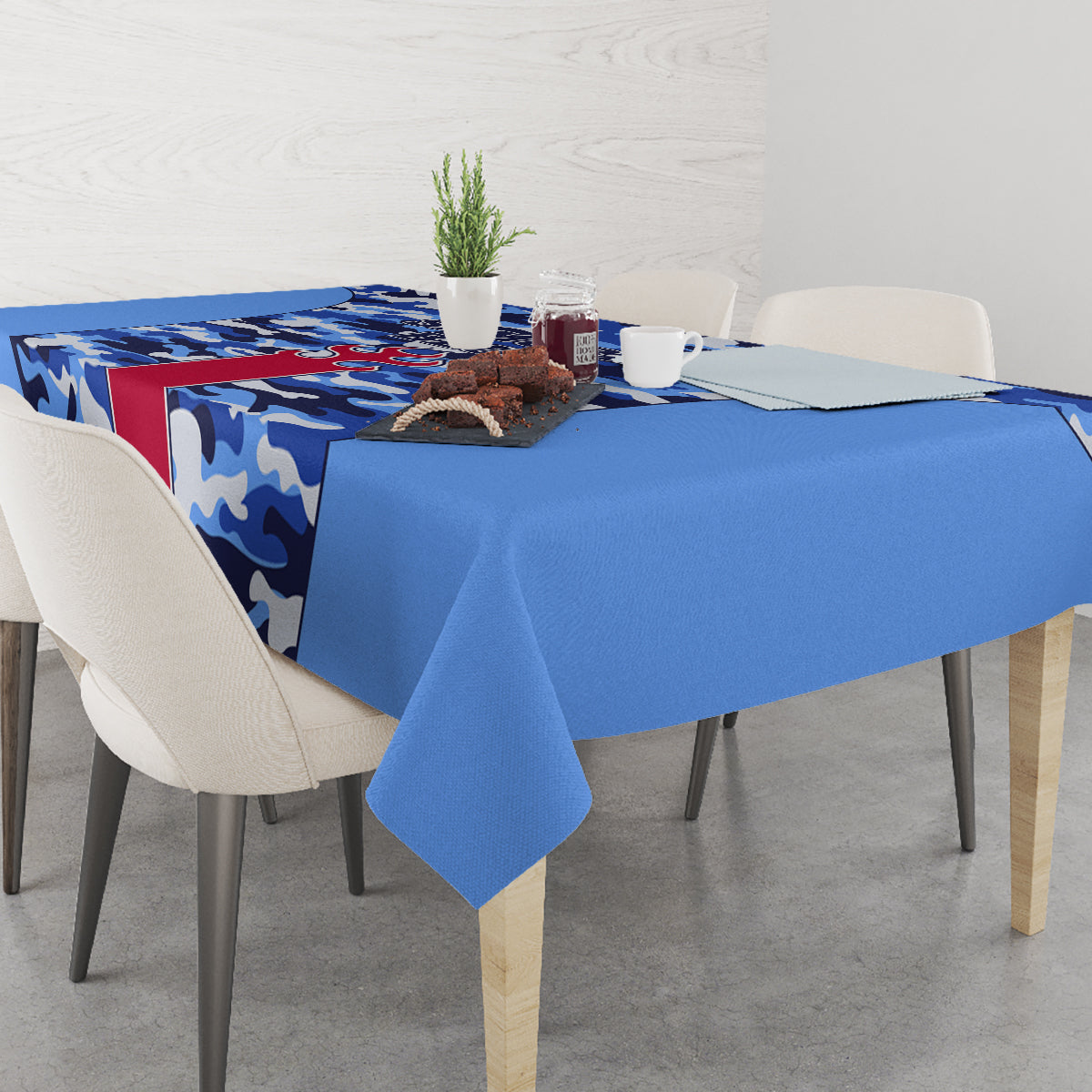 Blue camouflage tablecloth with red stripe along table edge