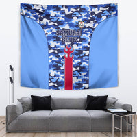 Blue camouflage sports tapestry with central red flame emblem and crest