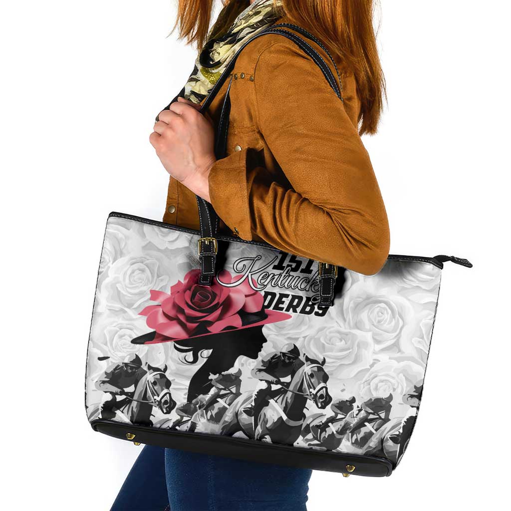 Leather tote bag with black handles, white rose pattern, horse silhouettes, and pink rose graphic.