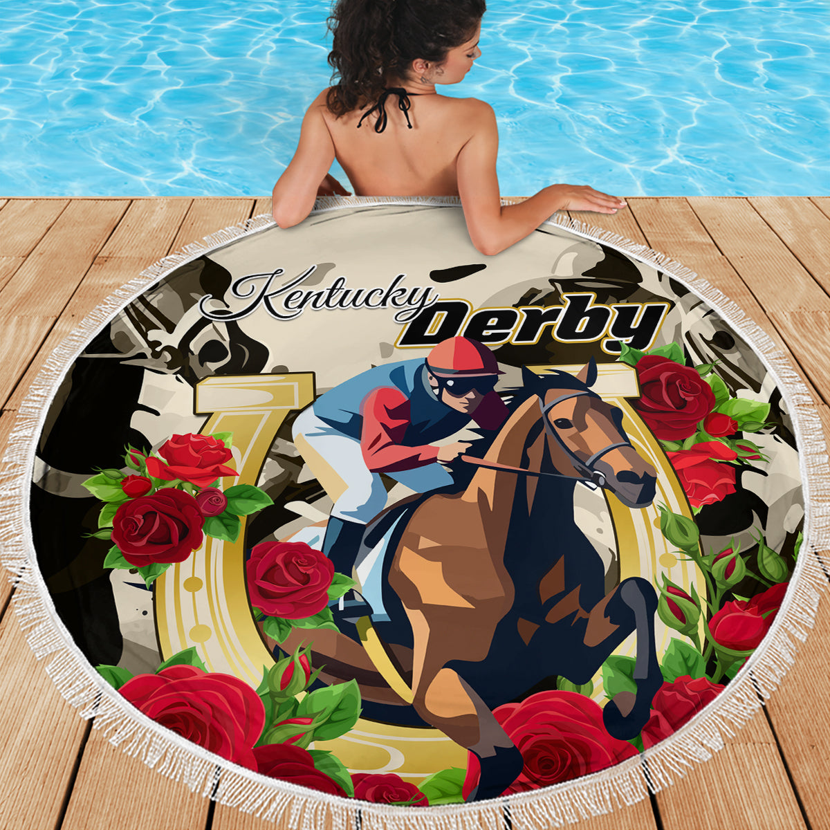 Round beach blanket with horse rider and “Kentucky Derby” logo amid floral roses, white fringe