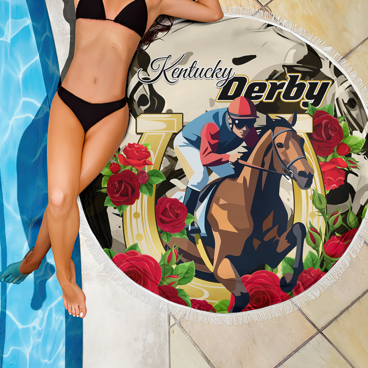 Round beach blanket with horse rider and “Kentucky Derby” branding amid red roses, white fringe
