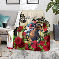 Decorative racing blanket with Kentucky Derby text, horse rider, and red roses on cream base