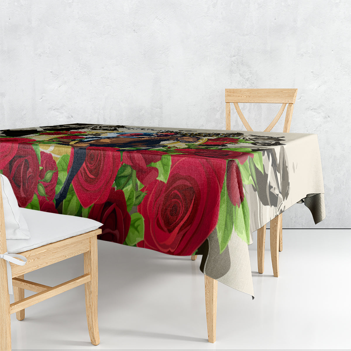 Tablecloth draped on dining table with red roses and multicolor leaf pattern