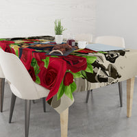 Tablecloth on dining table with red roses, green leaves, and horse-themed graphic