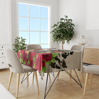 Tablecloth on dining table with red roses, green leaves, and Kentucky Derby horse art