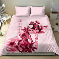 Pink bedding set with red horse racing rider artwork and lily blooms, two pillows