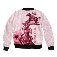 Pink bomber jacket with black ribbed hem, large back horse racing graphic in red tones