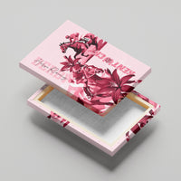 Pink horse racing canvas wall art angled on a backing, lilies and horses in detail