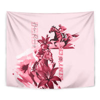 Pink horse racing tapestry close-up with jockey on horse and red flowers, vertical lettering