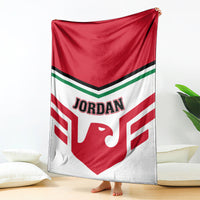 Red and white Jordan logo football blanket hanging with black/green stripe