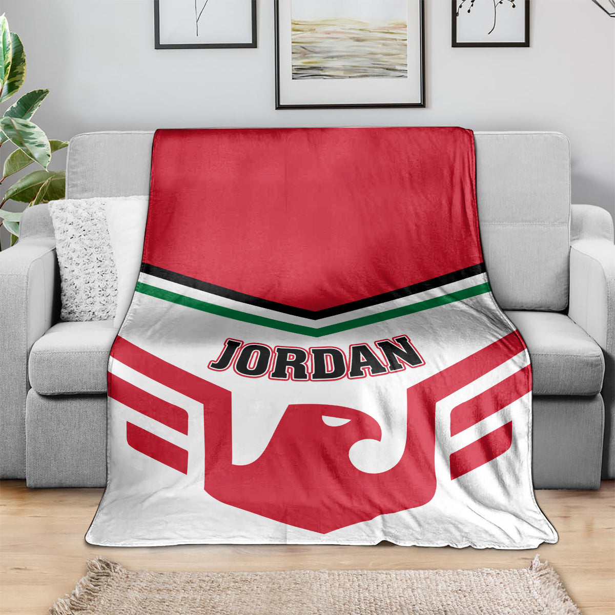 Red and white football blanket with Jordan logo draped over gray couch