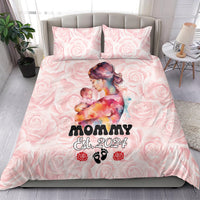 Pink Mother Day bedding set on bed with rose pattern, 'MOMMY Est. 2024' and pillow set