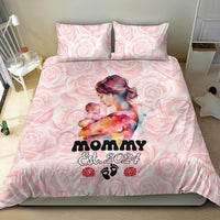 Pink Mother Day bedding set featuring rose pattern and 'MOMMY Est. 2024' with two pillowcases