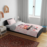 Pink Mother Day bedding set with rose pattern and 'MOMMY Est. 2024' on bed with two pillows