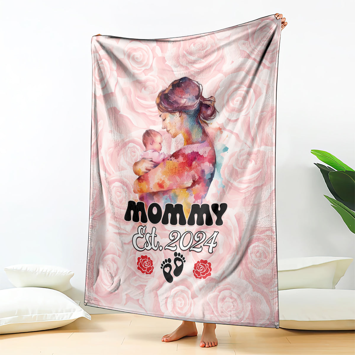 Pink printed mother’s day blanket featuring holding-mother-and-baby illustration