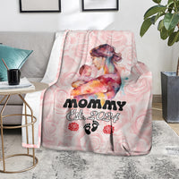 Pink mother’s day blanket folded on couch, Mom Est. 2024 and rose-paw graphics