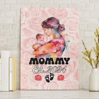Pink canvas wall art featuring a mom holding a baby, with MOMMY Est. 2024 text