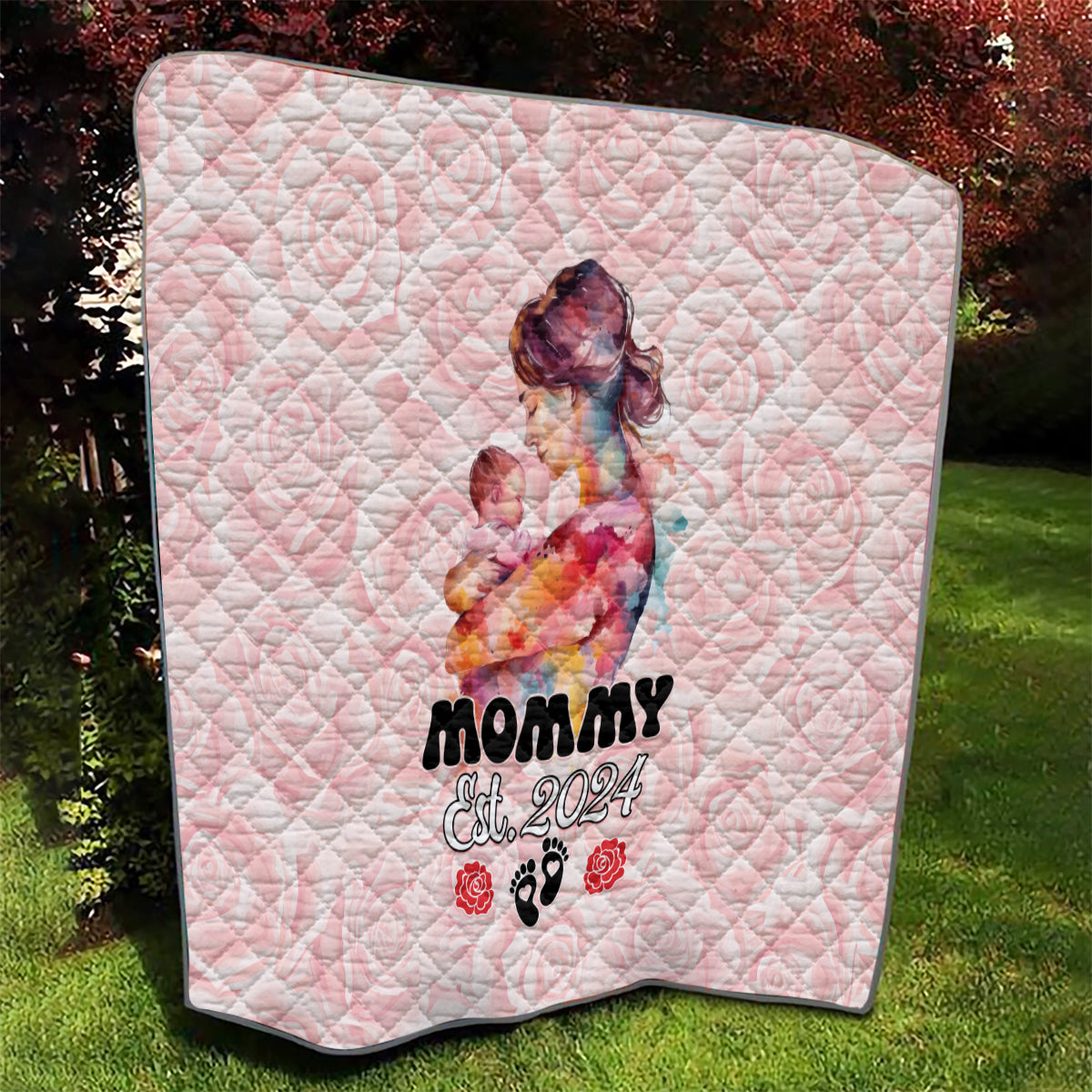 Pink quilt with diamond stitching, mom-and-baby portrait, and paw-print rose accents.