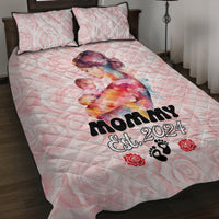 Pink quilt bed set with two pillowcases, mother artwork and black 'Mommy Est. 2024' lettering