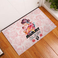 Pink rubber doormat with centered mom-and-baby graphic and “Mommy Est. 2024” lettering