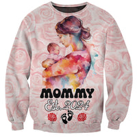 Pink unisex sweatshirt: watercolor mom holding baby, 'Mommy Est. 2024' graphic