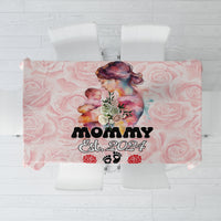 Pink rose-pattern tablecloth with “Mommy Est. 2024” text and paw-print accents