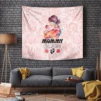 Pink rose-pattern tapestry showing a mother holding a baby, “Mommy Est. 2024”