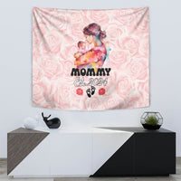 Pink floral hanging tapestry with mother holding baby, “Mommy Est. 2024” text
