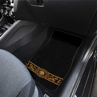 Car floor mat with black field and gold ornate border on rear passenger seat
