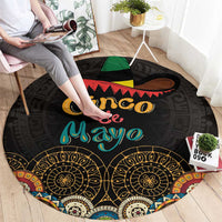 Black round carpet with sombrero and 'Cinco de Mayo' lettering, colorful patterned edge