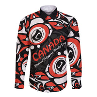 Long-sleeve button-up shirt in dark base with red, white Haida-style abstract pattern