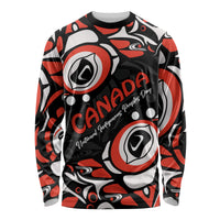 Black long-sleeve shirt with red and white Haida pattern and Canada lettering