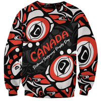 'Canada Indigenous Peoples Day' text on black unisex Haida-pattern sweatshirt