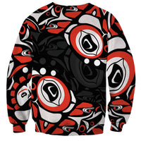 Black unisex sweatshirt with bold Haida-style red, gray, and white circle pattern
