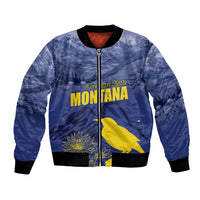Blue bomber jacket with full-zip front, black ribbed cuffs, and Montana graphic patch