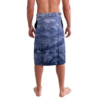 Blue knee-length board shorts with allover mountain and forest print